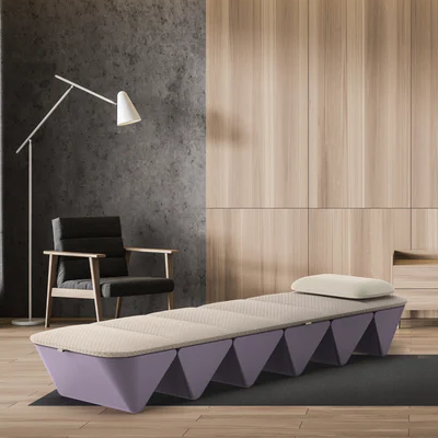 Opus Sound Bed in a serene therapy setting with a modern chair and wood-paneled background.